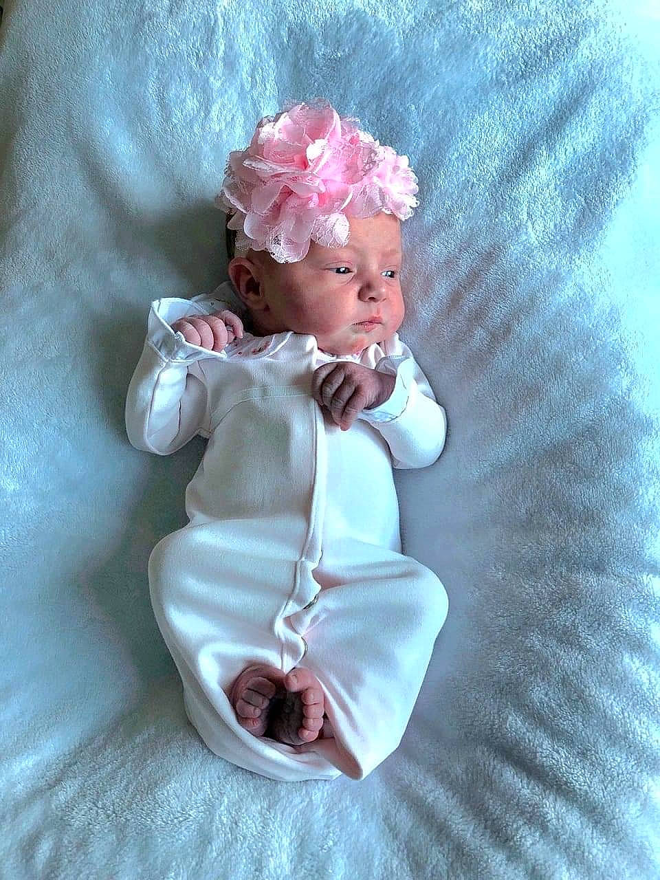 Brinley is registered to the contest to win money with this photo: angel, baby, baby_toddler_clothing, costume_hat, cut_flowers, doll, embellishment, fashion_accessory, hair_accessory, head, headband, headgear, headpiece, headwear, jewellery, magenta, peach, person, petal, pink