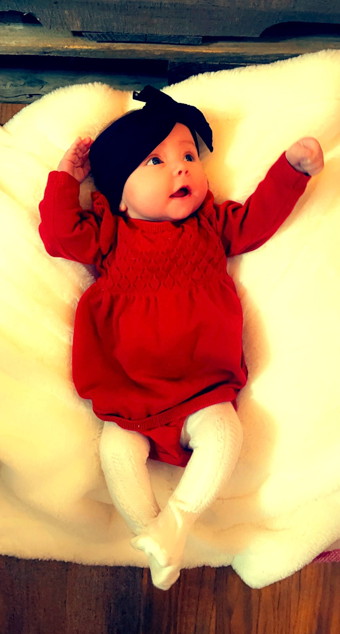Brinley is registered to the contest to win money with this photo: arm, baby, baby_toddler_clothing, cap, comfort, eye, finger, fun, gesture, happy, hat, head, headgear, headwear, human_body, magenta, person, pink, purple, skin