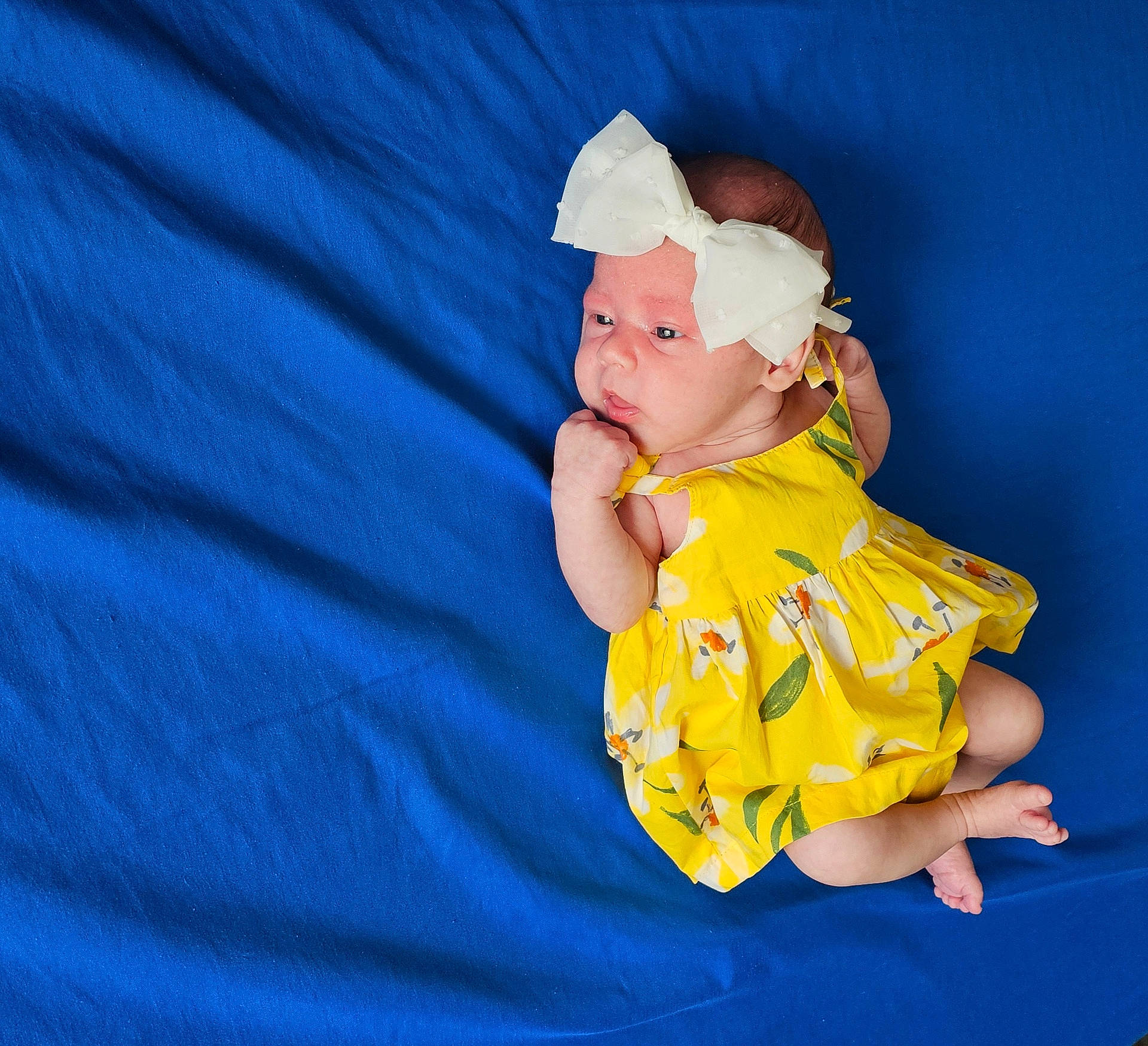 Magnolia joined the competition — help win amazing prizes! accessories, baby, blanket, bodypart, bonnet, clothing, dress, face, finger, frown, hand, happy, hat, head, newborn, person, photography, portrait, sitting, smile