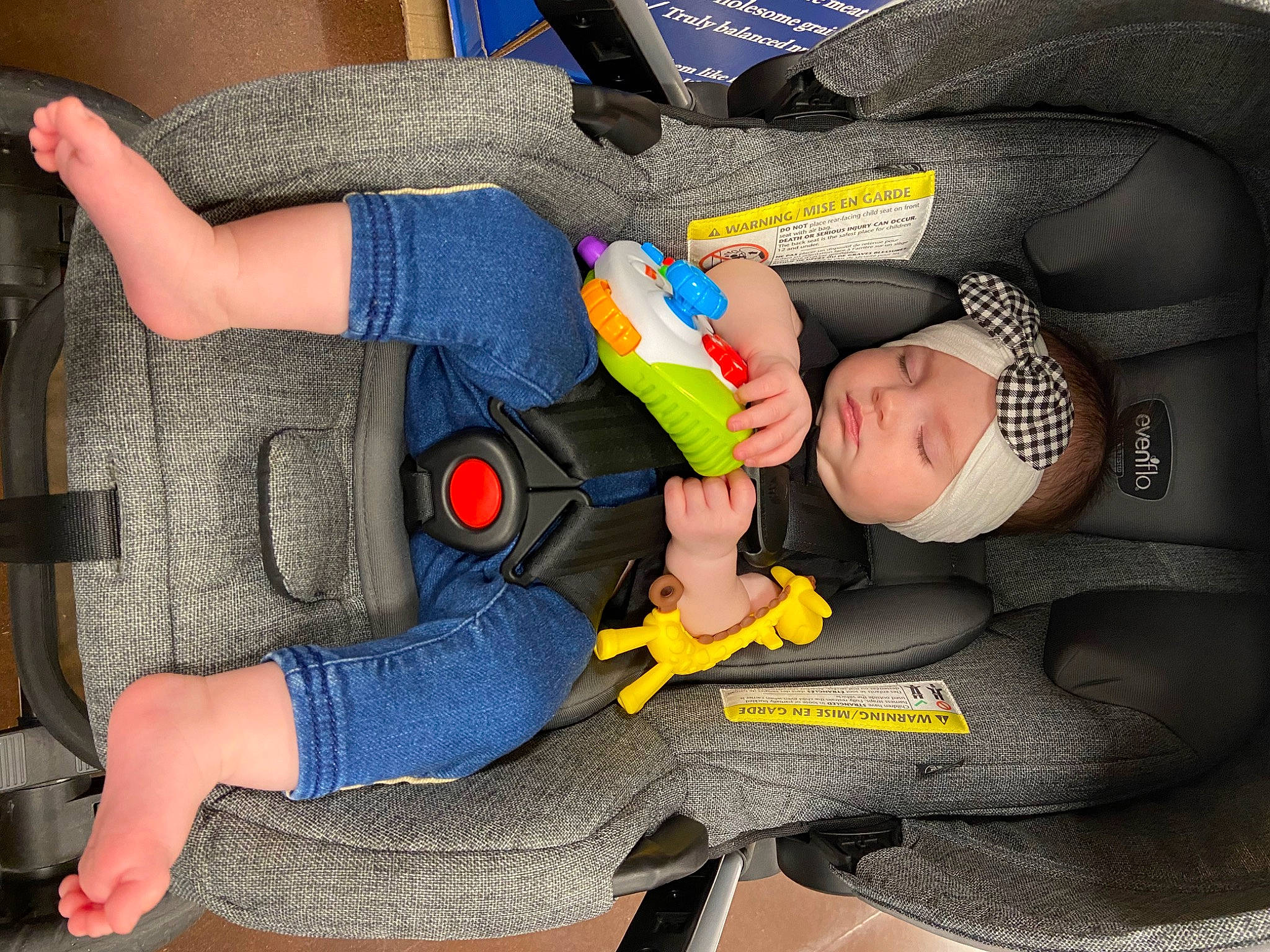 Blakely is registered to the contest to win money with this photo: arm, baby, baby_carriage, baby_products, baby_toddler_clothing, blue, car_seat, comfort, electric_blue, finger, fun, hand, headwear, human_leg, joint, knee, lap, leg, person, sitting
