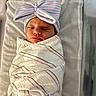 Oaklyn is registered to the contest to win money with this photo: newborn, baby, sleeping, wrapped, blanket, hat, bow, striped, hospital, bed, infant, cute, cozy, peaceful, child, portrait, laying, soft, fresh, cute_accessory