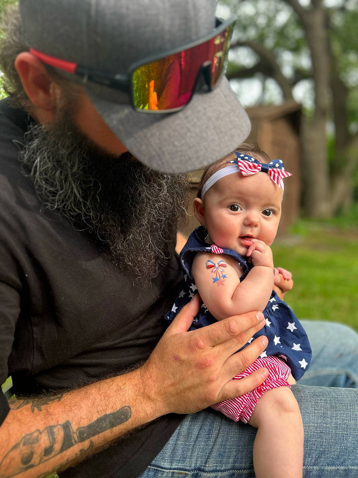 Brynleigh is registered to the contest to win money with this photo: baby, baby_toddler_clothing, baseball_cap, cap, child, event, eyewear, fashion_accessory, flash_photography, fun, grass, happy, hat, headgear, headwear, person, personal_protective_equipment, plant, recreation, sitting