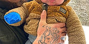 Bowen joined the competition — help win amazing prizes! baby, man, glasses, beard, tattoo, winter_clothing, mittens, jacket, hat, outdoor, snow, forest, holding, smiling, person, child, portrait, nature, cold_weather, cute