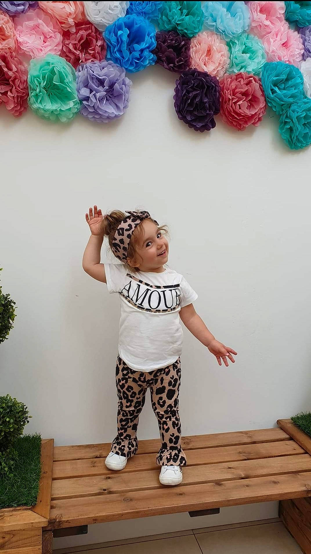 Alesia is registered to the contest to win money with this photo: baby_toddler_clothing, blue, child, clothing, cool, facial_expression, green, hairstyle, happy, head, headwear, joy, organ, pattern, person, pink, plant, sleeve, smile, t_shirt