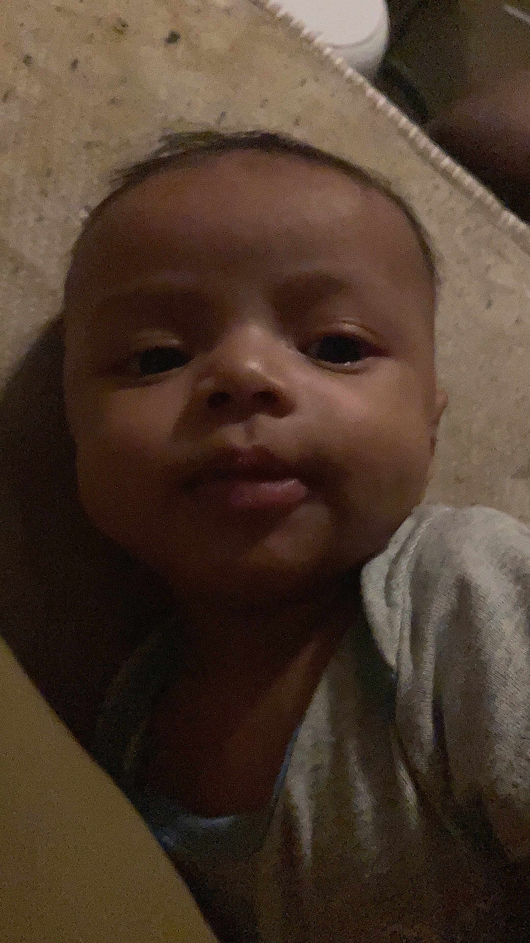 Dior joined the competition — help win amazing prizes! baby, face, child, infant, person, portrait, closeup, skin, head, eyes, mouth, cheeks, clothing, lying_down, indoors, soft_lighting, expressionless, young, human, sleepwear