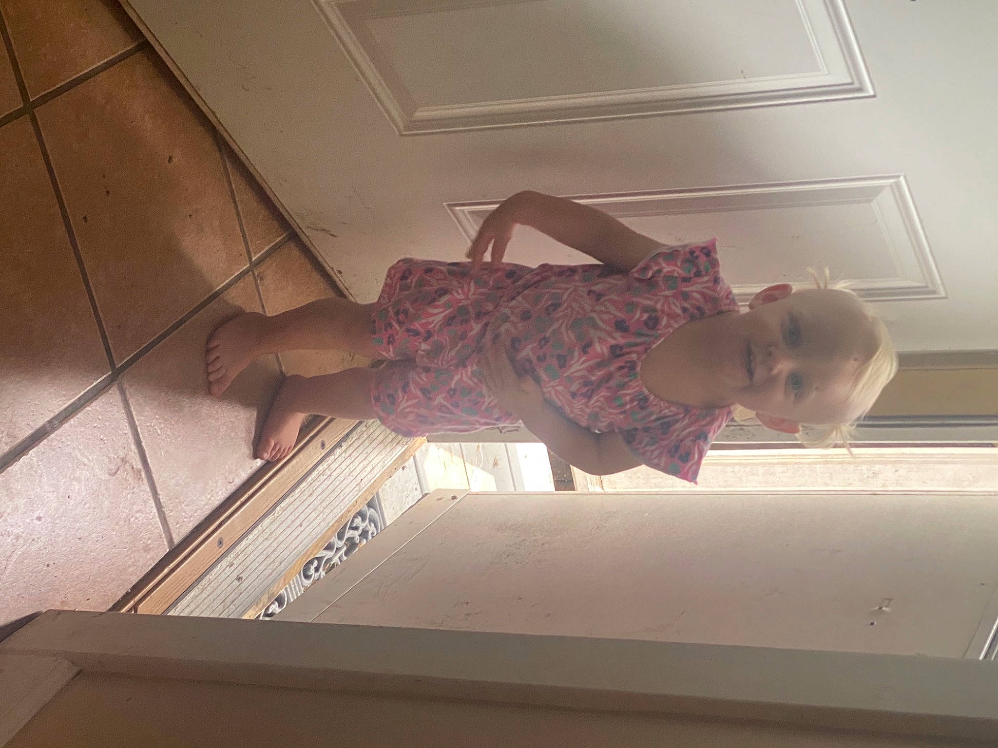 Kylee is registered to the contest to win money with this photo: arm, beauty, ceiling, comfort, dress, elbow, finger, floor, flooring, fun, hardwood, human_leg, interior_design, material_property, person, rectangle, room, standing, tints_and_shades, wall