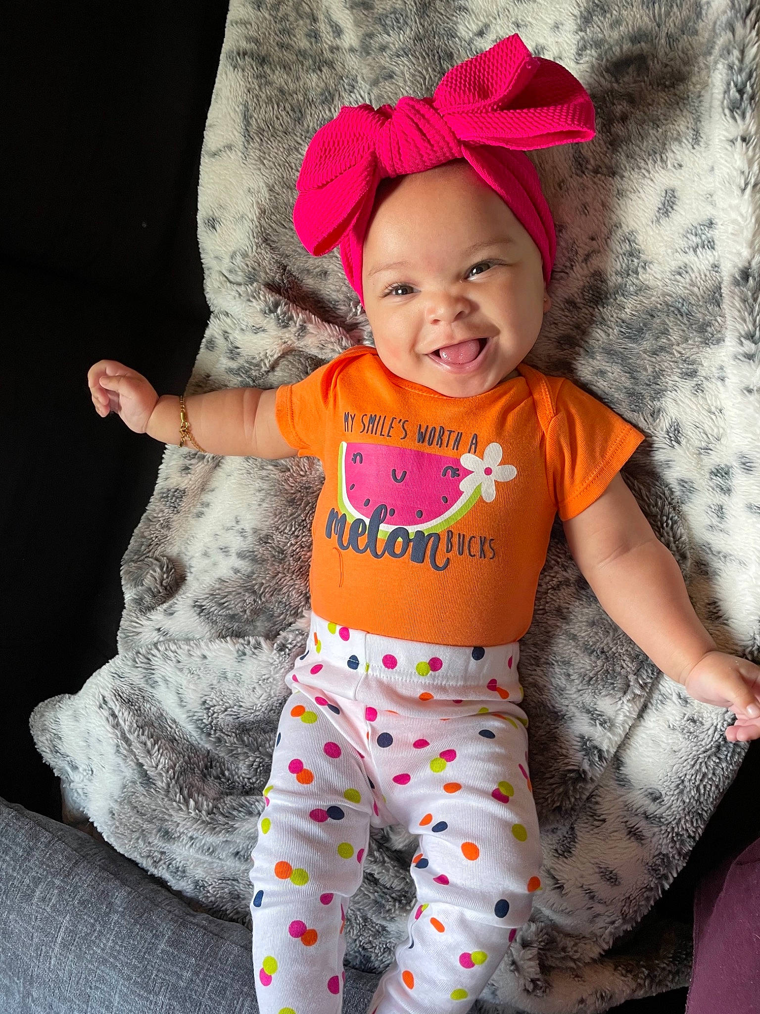 Milan is registered to the contest to win money with this photo: active_pants, arm, baby, baby_toddler_clothing, cap, clothing, cool, face, fun, happy, head, headwear, human_body, joy, person, photograph, pink, sleeve, smile, t_shirt