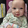 baby, infant, newborn, smile, eyes, face, blanket, onesie, floral_print, car_seat, head_support, hands, cozy, closeup, portrait, cute, adorable, soft_texture, warning_label, rosy_cheeks