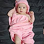adorable, baby, bare_skin, bath_time, bed_sheet, cute, dark_background, earring, hands, hooded_towel, infant, laying_down, legs, newborn, pink_towel, portrait, soft_texture, toes, towel_wrap, wide_eyes