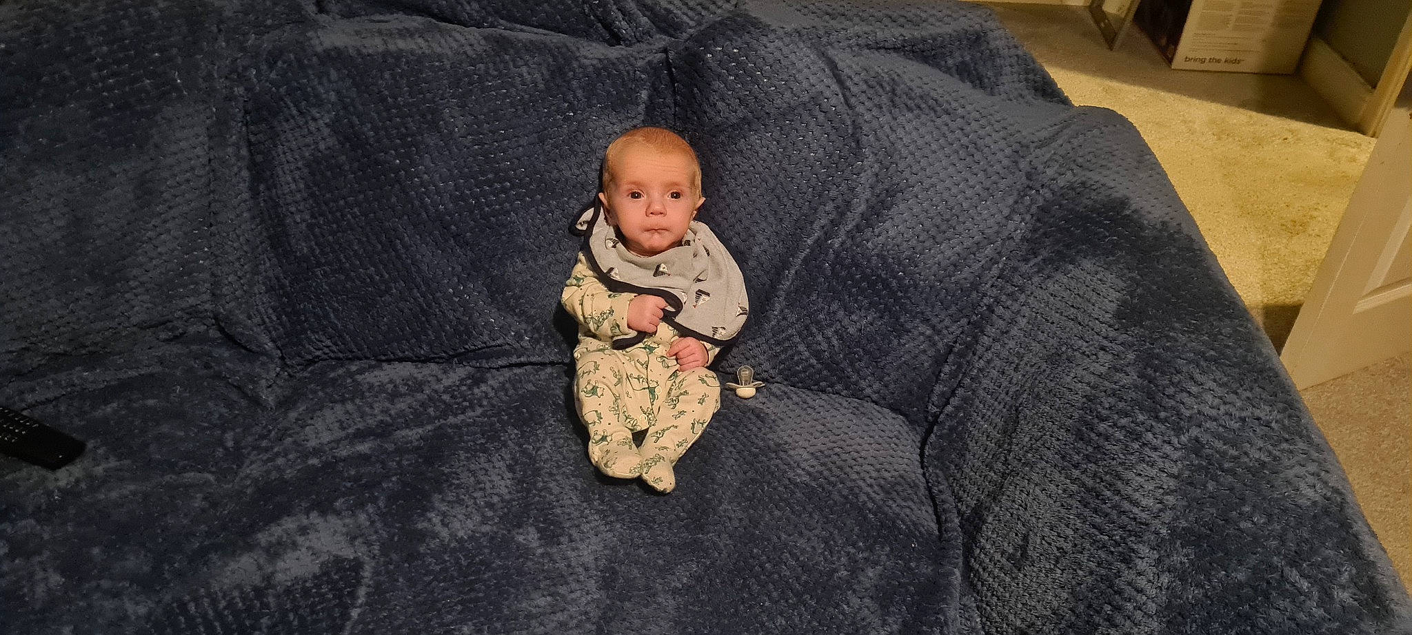 Aj joined the competition — help win amazing prizes! baby, baby_toddler_clothing, child, comfort, couch, flooring, grass, linens, pattern, person, room, sitting, sleeve, toddler, wood, wool