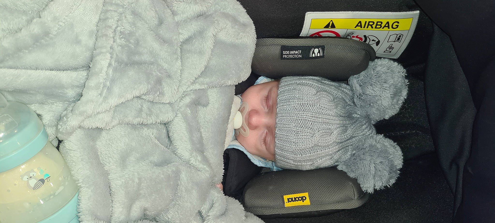 Aj is registered to the contest to win money with this photo: baby, baby_products, baby_sleeping, baby_toddler_clothing, comfort, fashion_accessory, font, foot, gesture, grey, headwear, linens, nail, nap, person, sleeve, sock, textile, thumb, toddler