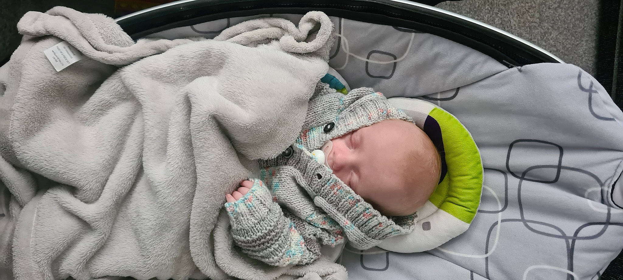 Aj joined the competition — help win amazing prizes! baby, baby_carriage, baby_products, baby_safety, baby_sleeping, baby_toddler_clothing, car_seat, child, comfort, finger, gesture, grey, infant_bed, nail, pattern, person, product, sitting, thumb, toddler