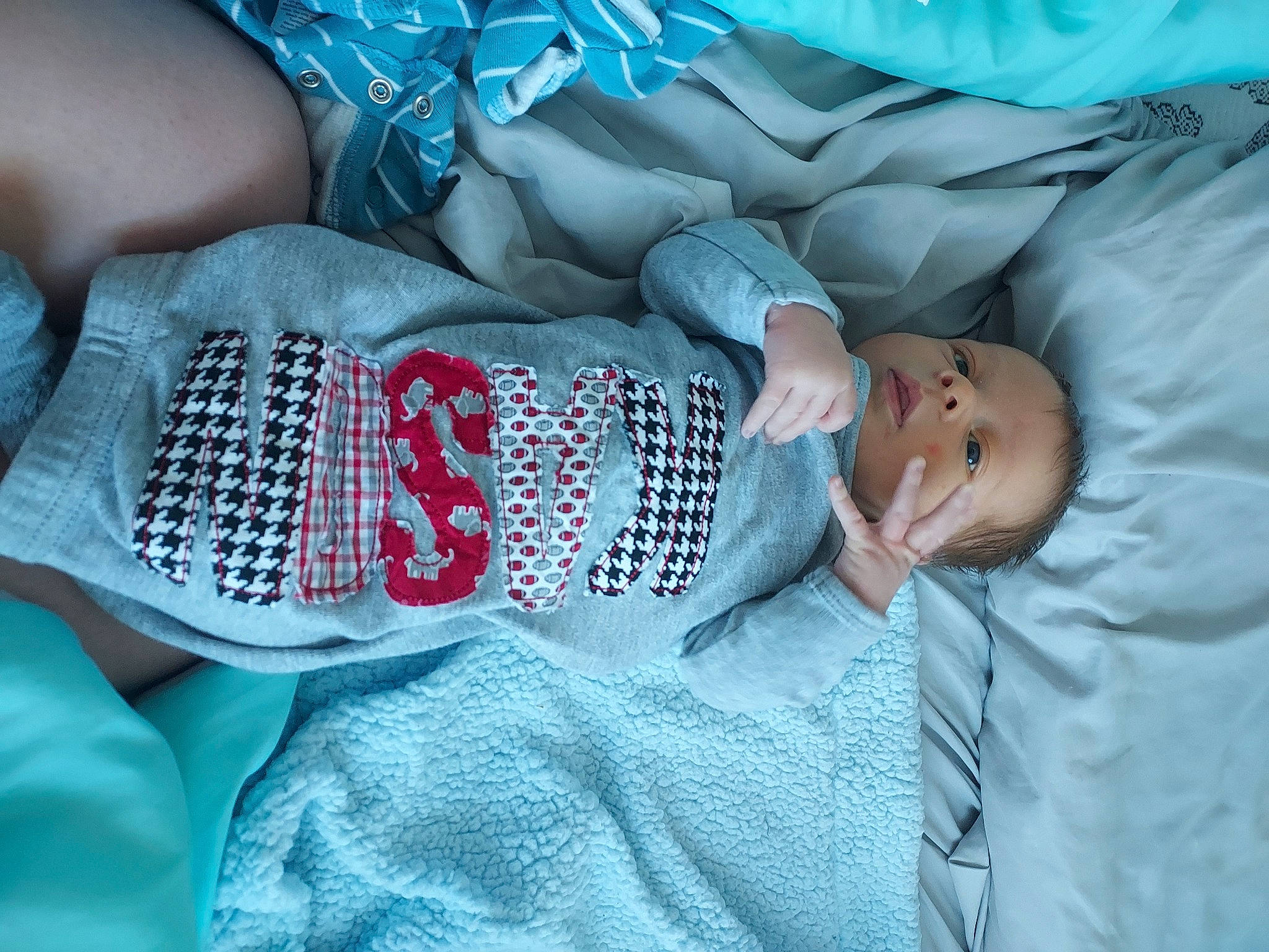 Kason is registered to the contest to win money with this photo: abdomen, baby, baby_sleeping, baby_toddler_clothing, blue, child, comfort, elbow, eye, glasses, head, human_body, linens, mouth, person, skin, sleeve, textile, thigh, toddler