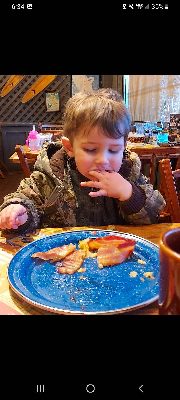 Karson joined the competition — help win amazing prizes! chair, child, comfort_food, cooking, cuisine, cup, dish, dishware, food, fun, ingredient, jacket, junk_food, person, plate, recreation, serveware, sharing, table, tableware