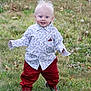 child, toddler, baby, grass, field, outdoor, smiling, blue_eyes, blond_hair, patterned_shirt, red_pants, shoes, walking, standing, portrait, candid, dandelion, nature, cute, playful