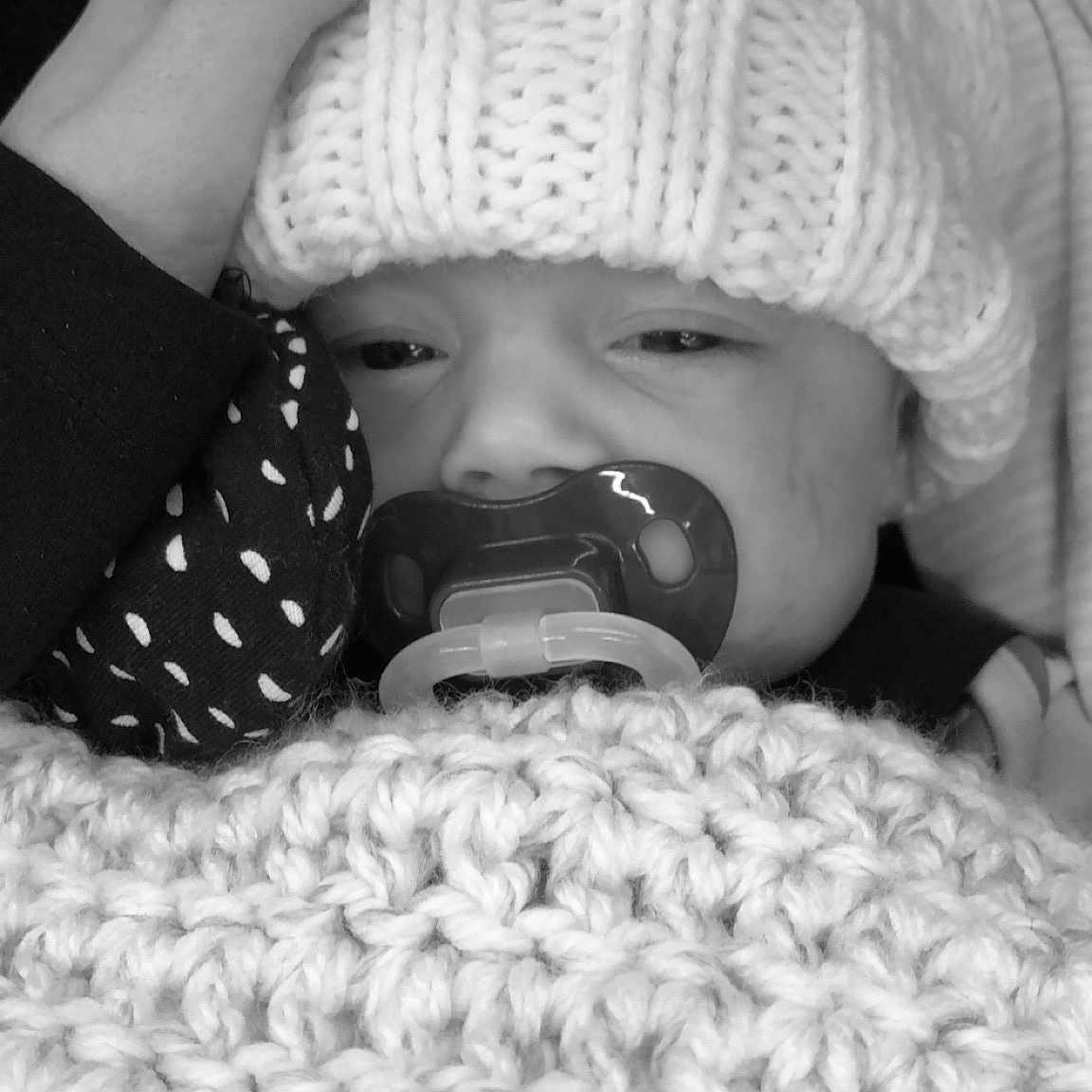 Ainsley joined the competition — help win amazing prizes! baby, beanie, black_and_white, bonnet, cap, child, crochet, headgear, knitting, monochrome, monochrome_photography, mouth, nap, nose, photography, sleep, smile, style, toddler, white
