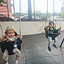 Robert is registered to the contest to win money with this photo: child, toddler, swing, playground, outdoor, fence, car, urban, pavement, clothing, hood, pacifier, toy, person, fun, activity, daytime, casual, expression, metal
