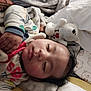baby, sleeping, blanket, teddy_bear, soft_toy, pajamas, face, hand, child, cozy, bed, cute, comfort, rest, indoor, infant, peaceful, portrait, plush, sleep
