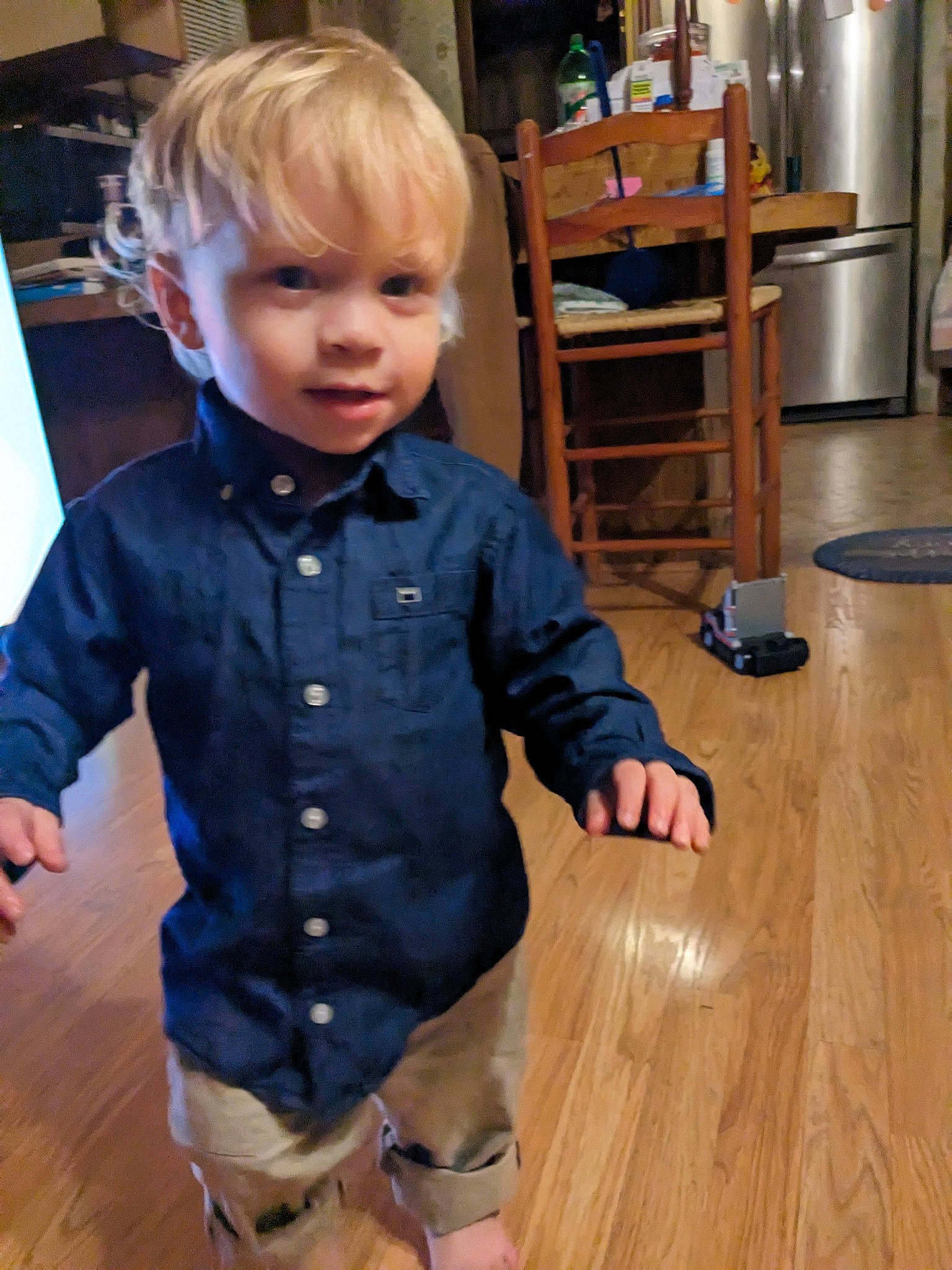 Lliam joined the competition — help win amazing prizes! baby_toddler_clothing, blond, chair, child, dress_shirt, electric_blue, floor, flooring, hairstyle, hardwood, joint, knee, person, sleeve, standing, thigh, toddler, varnish, waist, wood