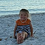 beach, child, coast, dress, foot, happy, hill, nature, necklace, ocean, outdoor, person, sand, seaside, shells, sitting, sky, smile, sunset, water