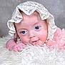 baby, infant, blue_eyes, lace_bonnet, pink_clothing, pearls, fluffy_blanket, close_up, cute, resting, portrait, soft_texture, child, face, smile, newborn, adorable, innocence, cute_expression, cozy