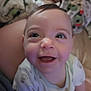 Xena is registered to the contest to win money with this photo: baby, smiling, face, child, infant, happy, person, clothing, cute, portrait, indoors, skin, eyes, mouth, cheeks, hair, sitting, blanket, soft, cozy