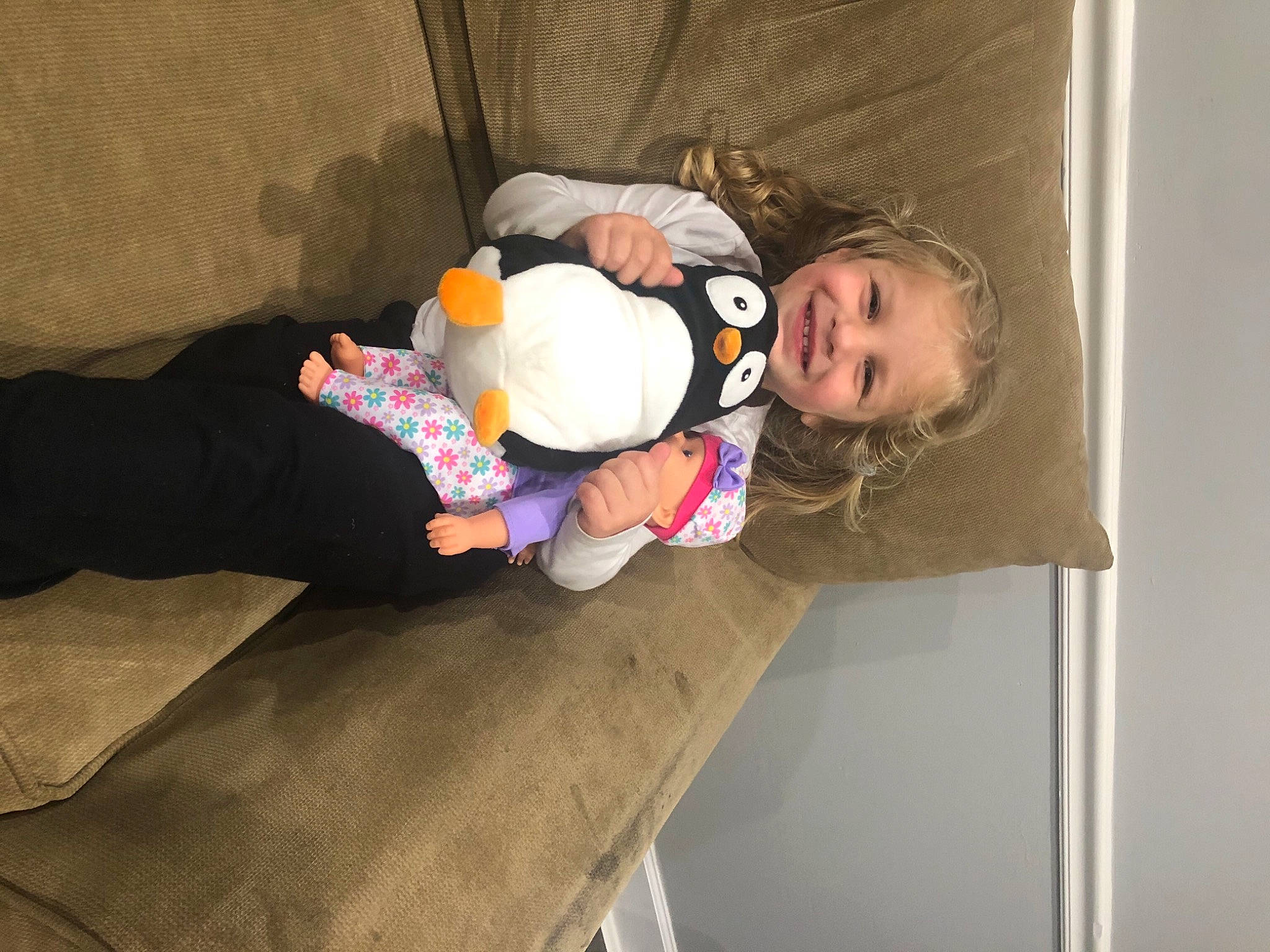 Kenzley is registered to the contest to win money with this photo: baby, baby_products, baby_toddler_clothing, child, comfort, flooring, fun, joy, linens, person, room, sitting, smile, sock, toddler, wood