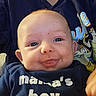 Axel joined the competition — help win amazing prizes! baby, smiling, blue_eyes, face, infant, clothing, navy_shirt, text_on_clothing, person, cute, child, indoors, holding, portrait, happy, skin, head, expression, toddler, casual