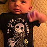 baby, infant, onesie, clothing, jack_skellington, character, black, cute, spooky, bed, blanket, texture, face, hand, lying_down, portrait, child, young, person, indoor