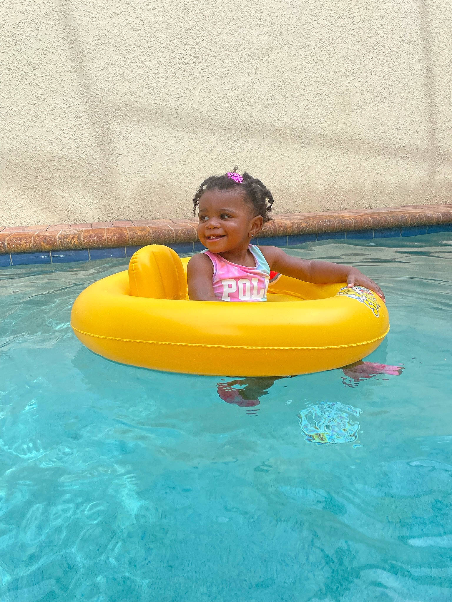 Aliyaha is registered to the contest to win money with this photo: baby, baby_float, baby_toddler_clothing, bathing, child, fun, happy, inflatable, joy, leisure, leisure_centre, nonbuilding_structure, person, personal_protective_equipment, recreation, smile, swimming_pool, swimwear, toddler, vacation