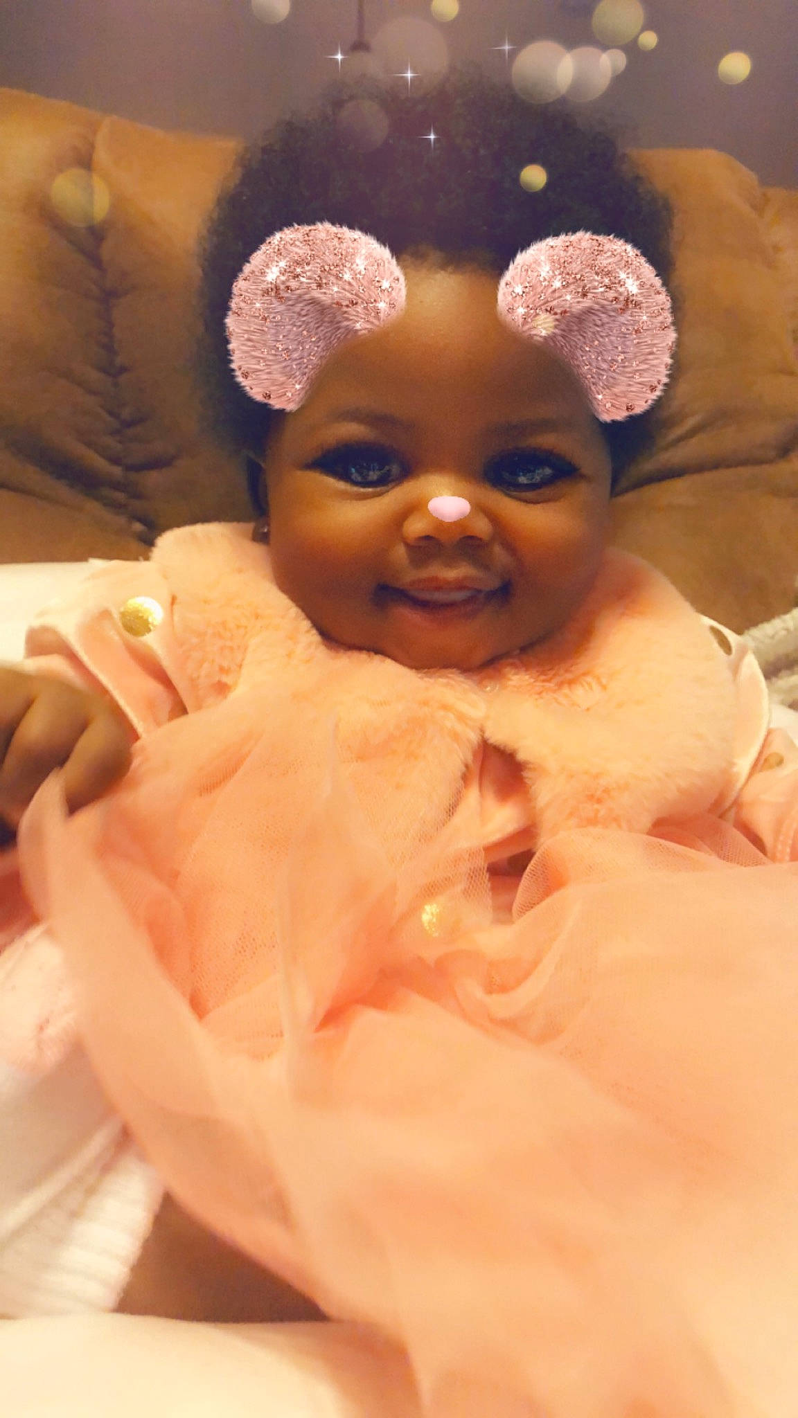 Symara is registered to the contest to win money with this photo: baby, cheek, child, ear, eye, face, hair_accessory, head, joy, lip, nose, person, pink, skin, smile, toddler