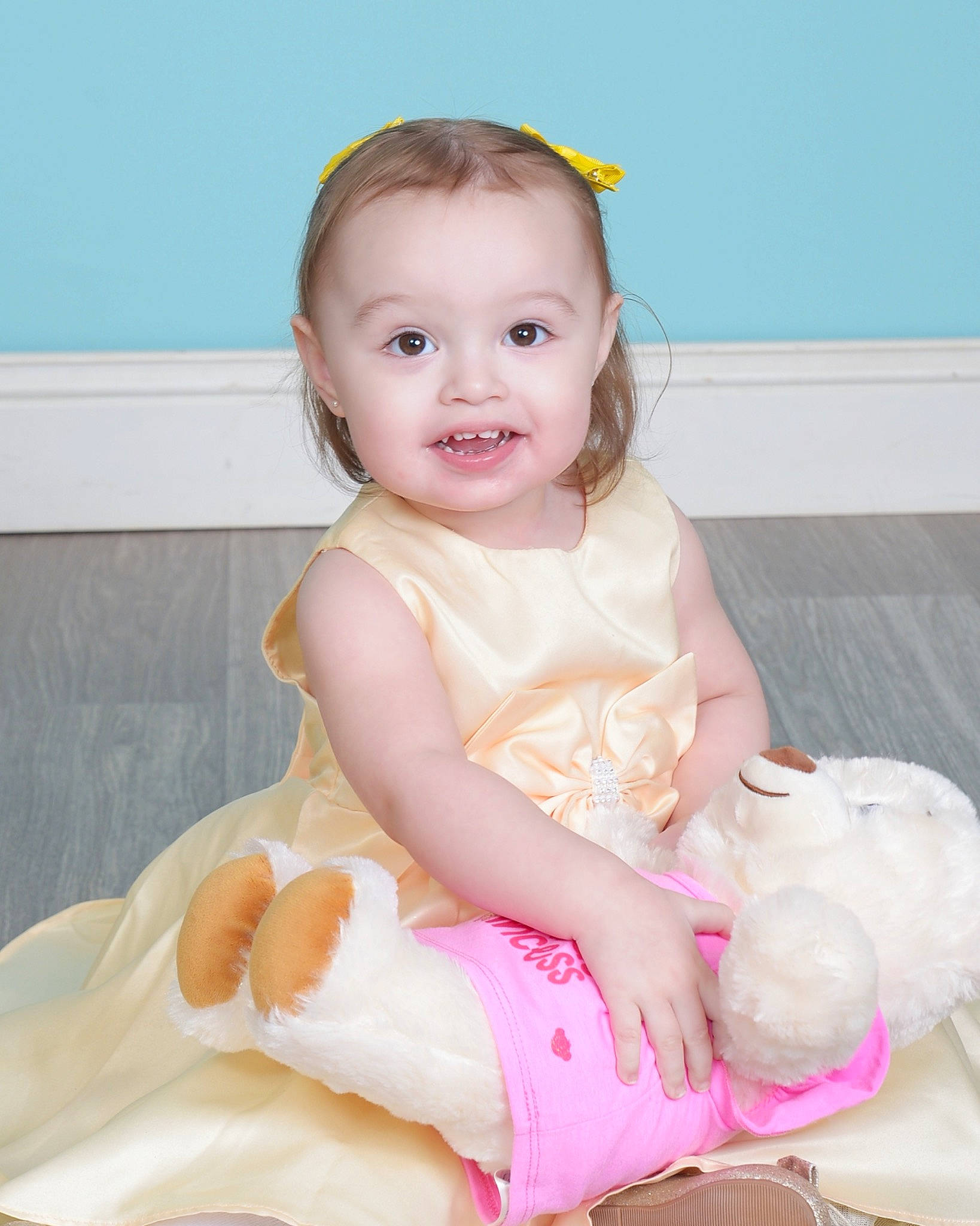 Lucero is registered to the contest to win money with this photo: baby, baby_toddler_clothing, cheek, child, day_dress, dress, embellishment, fashion_accessory, happy, iris, pattern, peach, person, pink, sitting, skin, sleeve, smile, sock, toddler