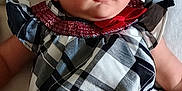 Celine joined the competition — help win amazing prizes! baby, child, infant, headband, flower, dress, plaid, red_bow, lying_down, blanket, soft, cute, face, portrait, young_child, indoors, person, clothing, looking, adorable