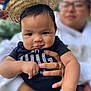 Jefe Noel joined the competition — help win amazing prizes! baby, child, sombrero, hat, hand, person, smile, face, black_clothing, adult, ring, holding, outdoor, portrait, cute, closeup, skin, eyes, fingers, expression