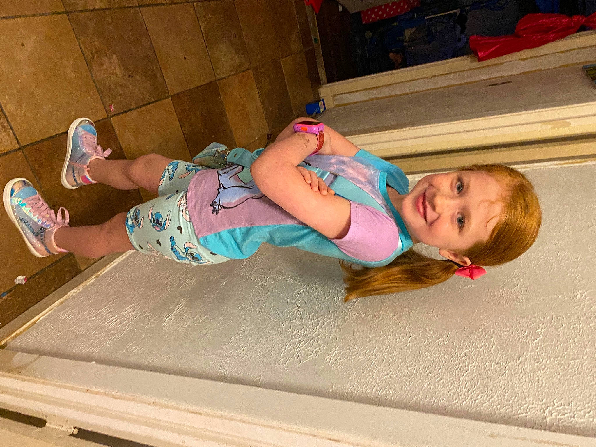 Alaina joined the competition — help win amazing prizes! automotive_exterior, baby_toddler_clothing, barefoot, child, electric_blue, flooring, fun, human_leg, joy, knee, leg, leisure, mouth, person, pink, sitting, smile, sportswear, sunglasses, thigh
