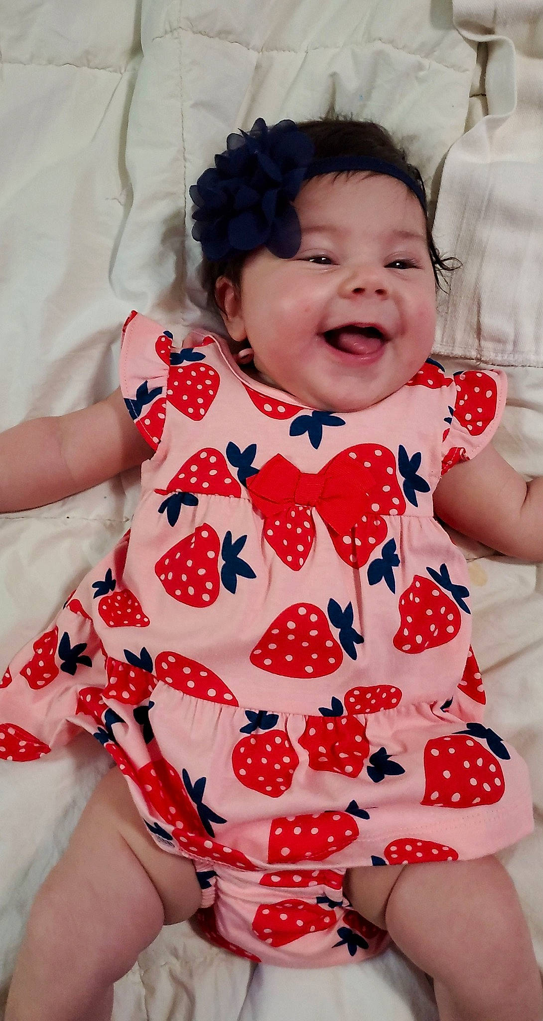 Lillian is registered to the contest to win money with this photo: baby, baby_products, baby_toddler_clothing, child, design, facial_expression, pattern, person, polka_dot, product, smile, textile, toddler