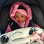 baby, smile, headband, pink_jacket, blanket, car_seat, child, cozy, cute, infant, apparel, face, happy, indoors, person, portrait, seatbelt, warm, toddler, wrapped