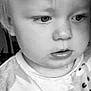 child, toddler, face, portrait, black_and_white, curious, expression, clothing, pattern, soft_lighting, closeup, young, person, indoors, cute, small, innocent, baby, head, looking