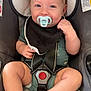 Linkin is registered to the contest to win money with this photo: baby, black_bib, car_seat, child, closeup, clothing, cute, face, feet, happy, head, indoors, infant, legs, pacifier, safety, seatbelt, skin, smiling, strap