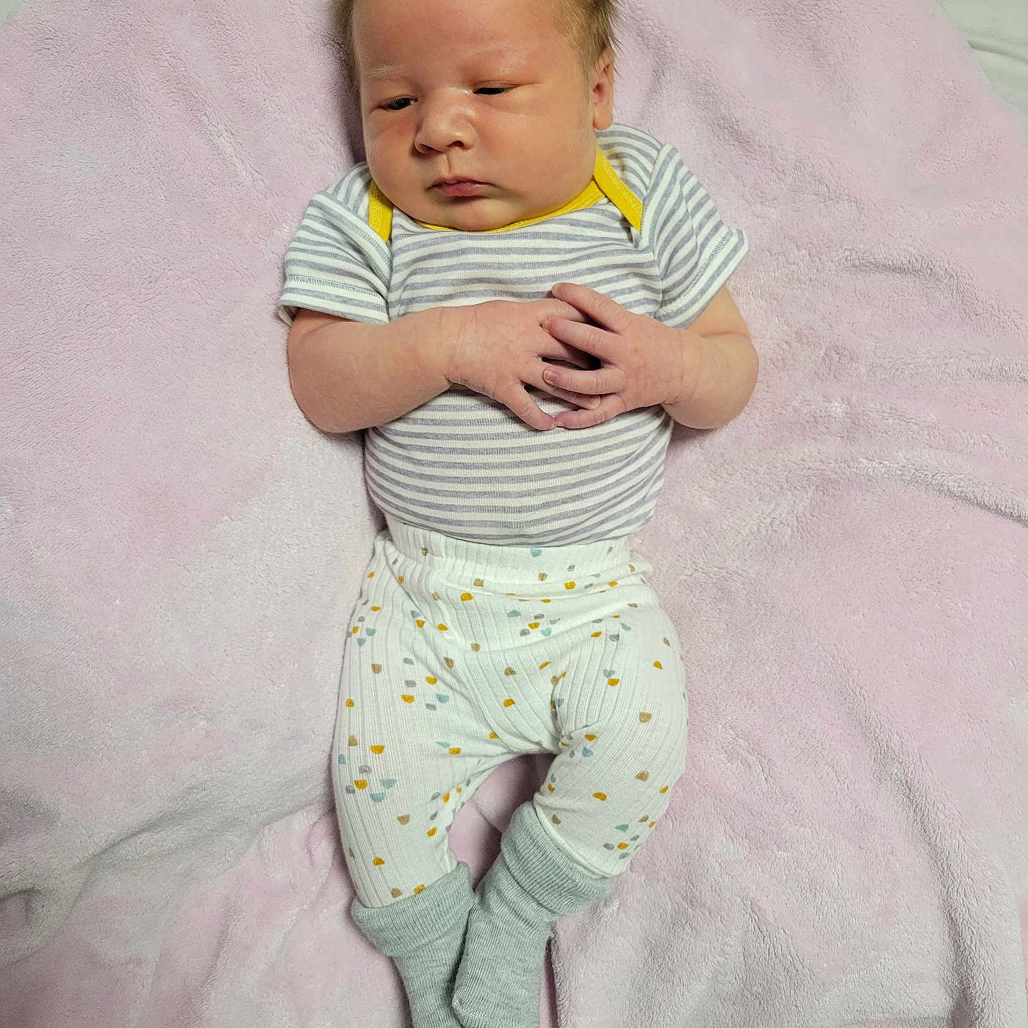 Farrah is registered to the contest to win money with this photo: baby, bed, blanket, bodypart, clothing, cushion, face, finger, furniture, glove, hand, head, hosiery, newborn, pants, person, photography, portrait, sleeping, sock