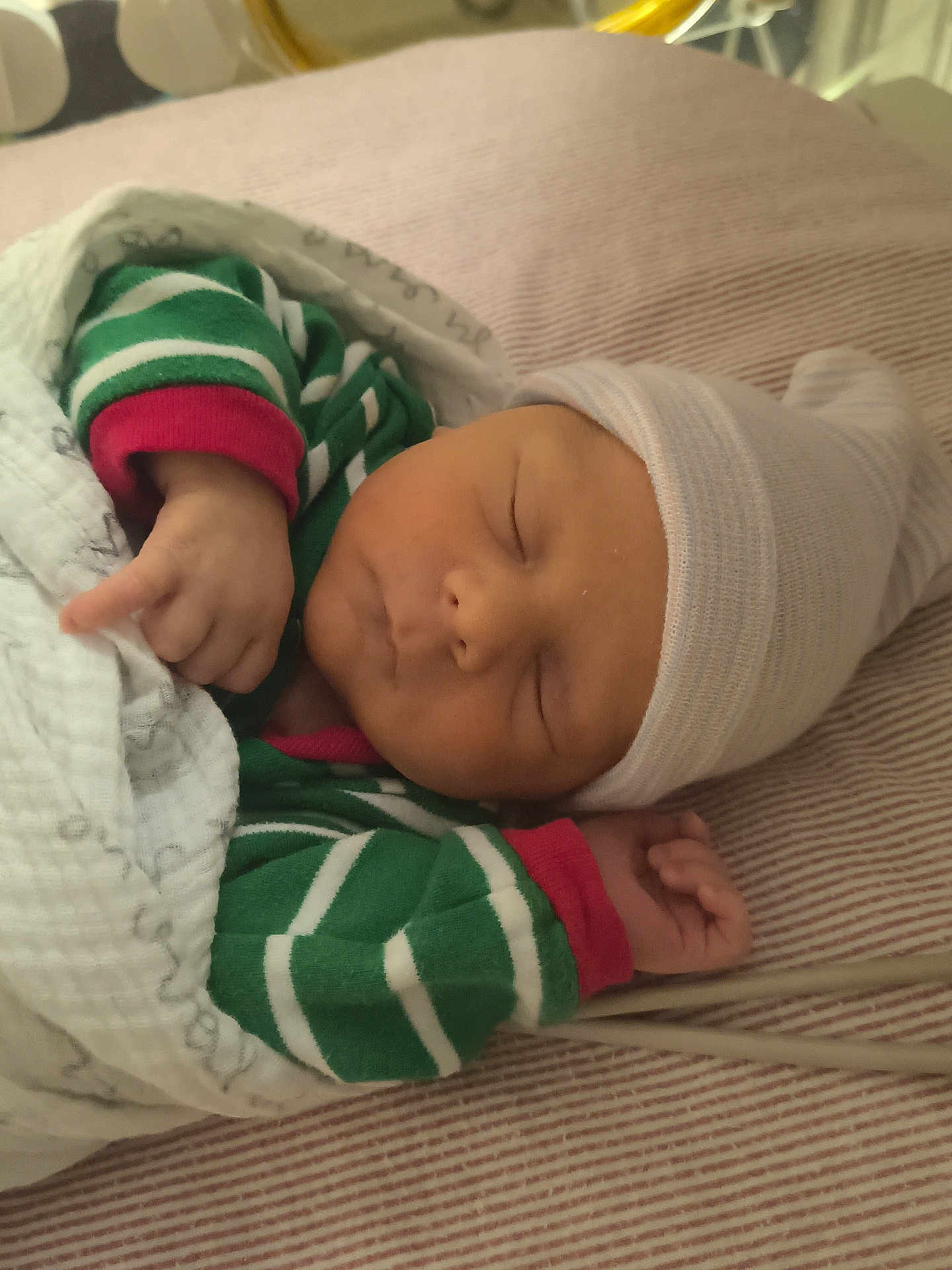 Leonidas joined the competition — help win amazing prizes! newborn, baby, sleeping, hat, blanket, striped_clothing, green_clothing, white_blanket, peaceful, infant, cozy, couch, bed, resting, child, person, indoors, soft_light, closeup, portrait