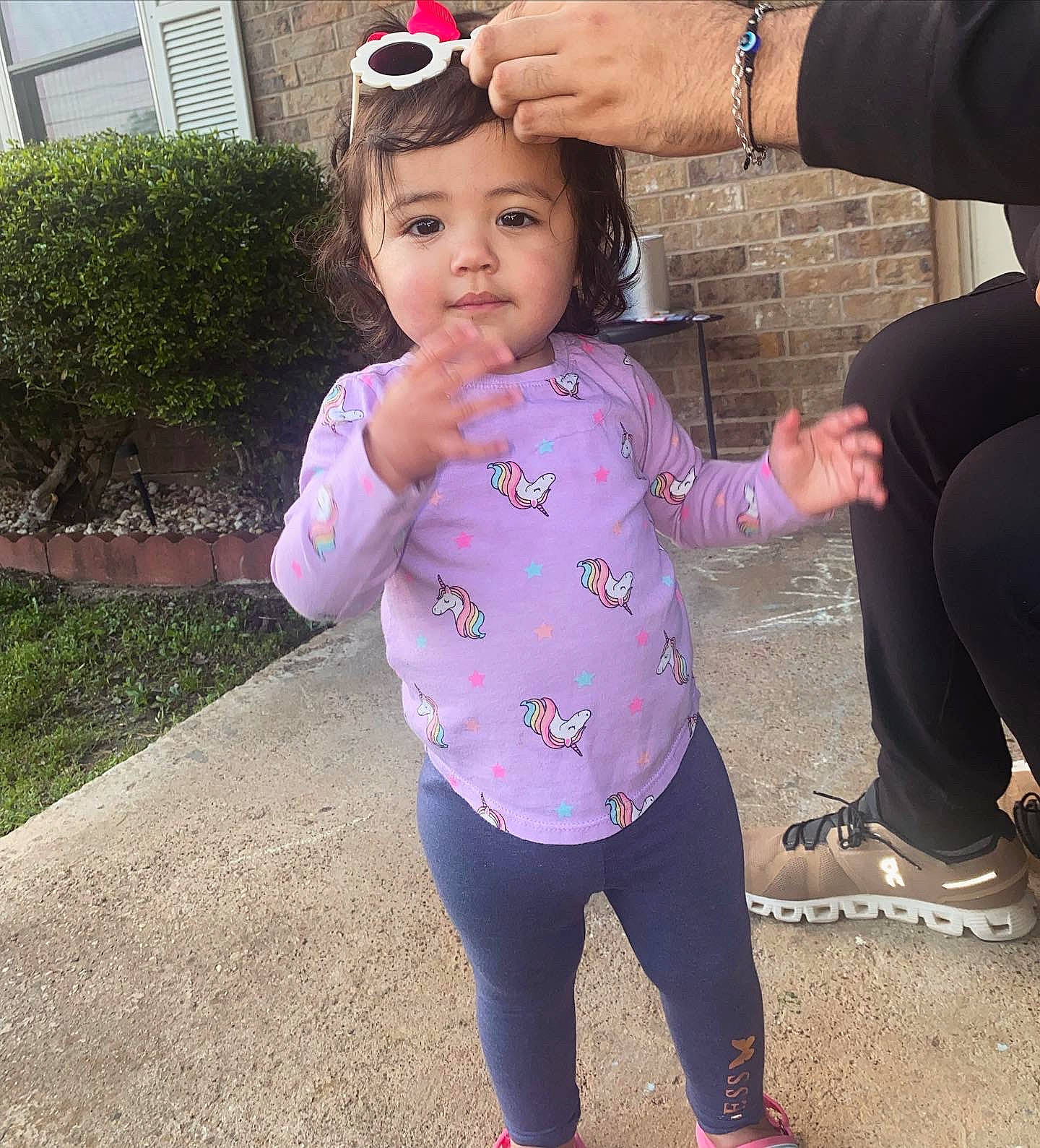 Dahlia is registered to the contest to win money with this photo: baby_toddler_clothing, child, eye, face, fun, gesture, goggles, grass, happy, hat, leisure, magenta, person, pink, plant, sleeve, sunglasses, thigh, toddler, tree