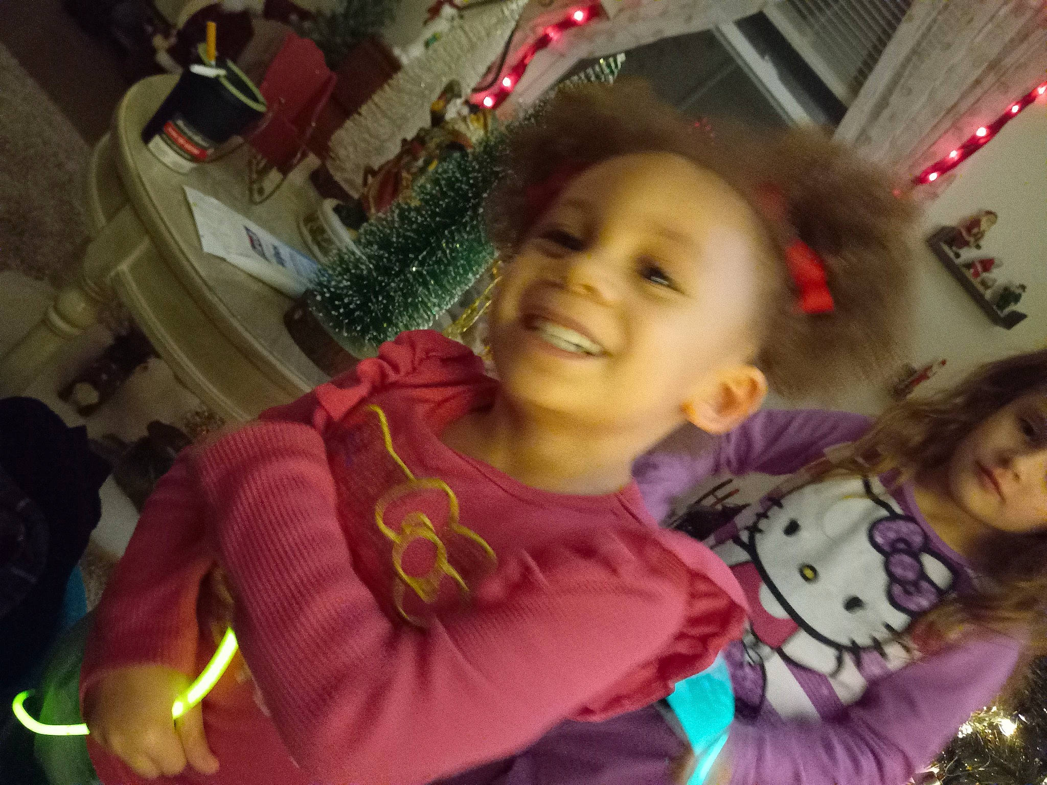 Geneva joined the competition — help win amazing prizes! bangs, black_hair, cheek, child, cool, event, finger, fun, happy, joy, leisure, magenta, mouth, nose, person, room, sitting, skin, smile, t_shirt