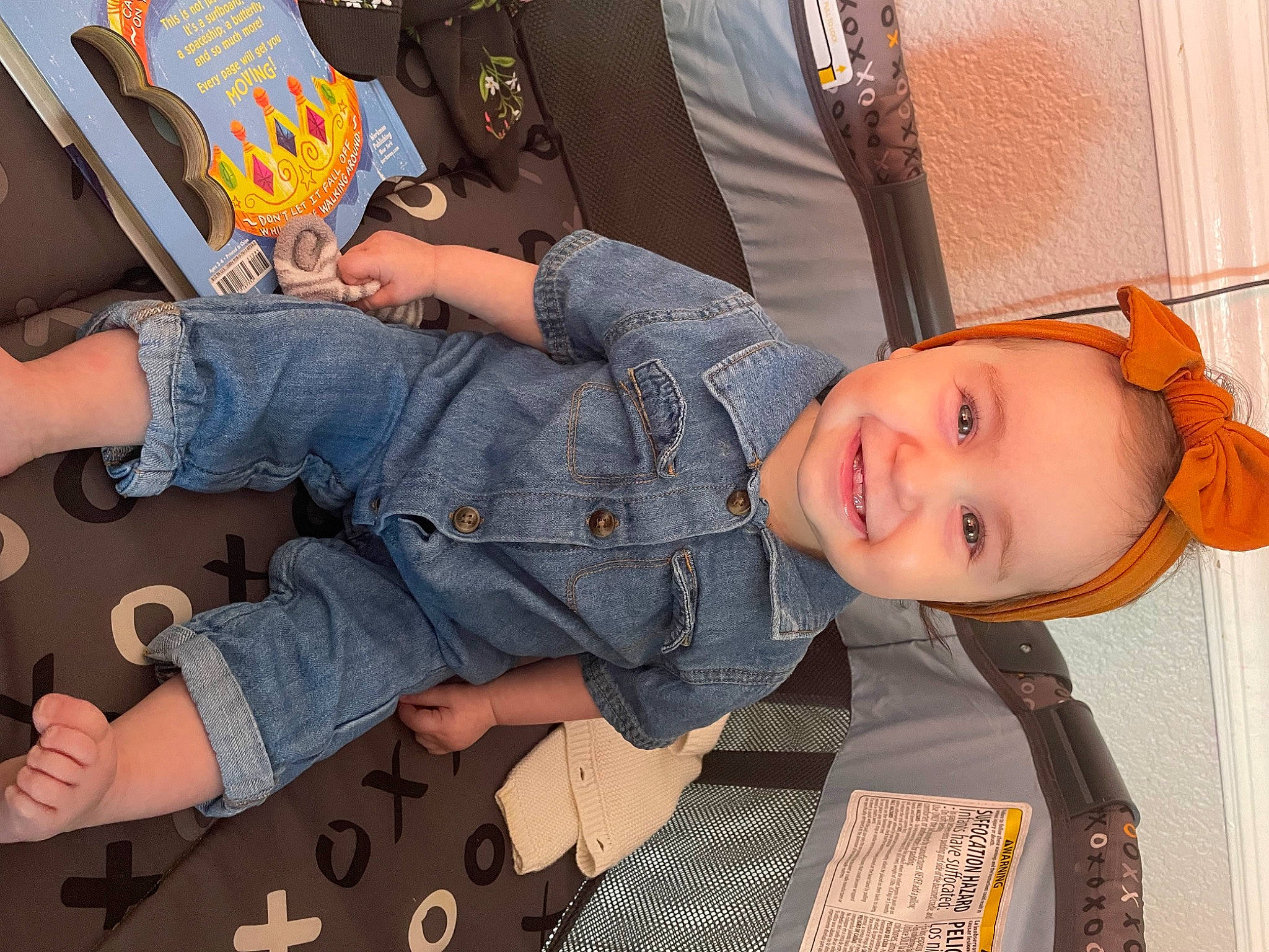 Cecilia is registered to the contest to win money with this photo: chair, child, comfort, denim, elbow, electric_blue, fun, gesture, human_leg, joint, joy, lap, leisure, nail, pattern, person, sitting, smile, thigh, thumb