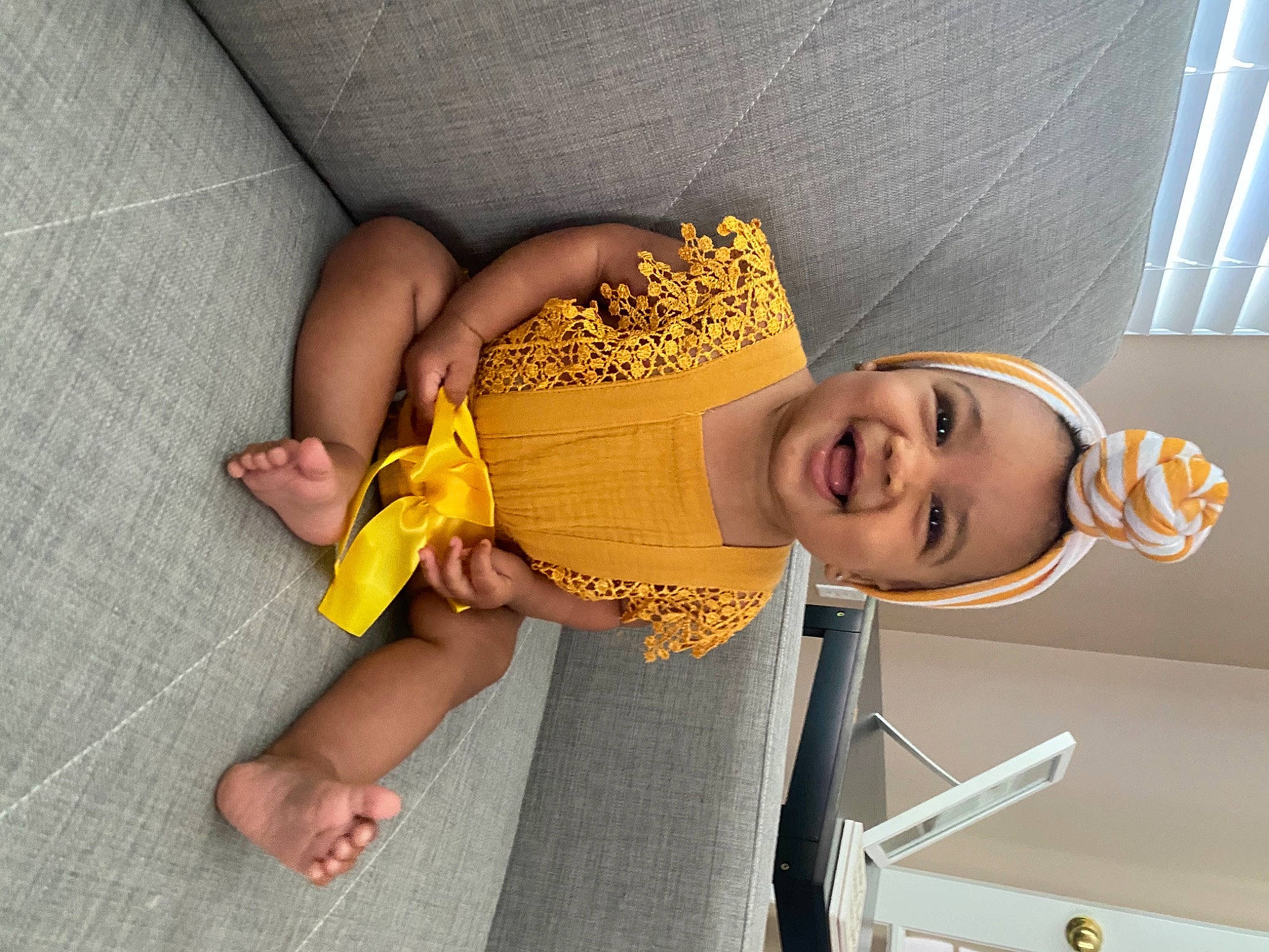 Kynleigh joined the competition — help win amazing prizes! baby, child, eyewear, facial_expression, fashion_accessory, finger, foot, fun, happy, hat, headgear, human_leg, joint, knee, pattern, person, room, smile, sun_hat, thigh