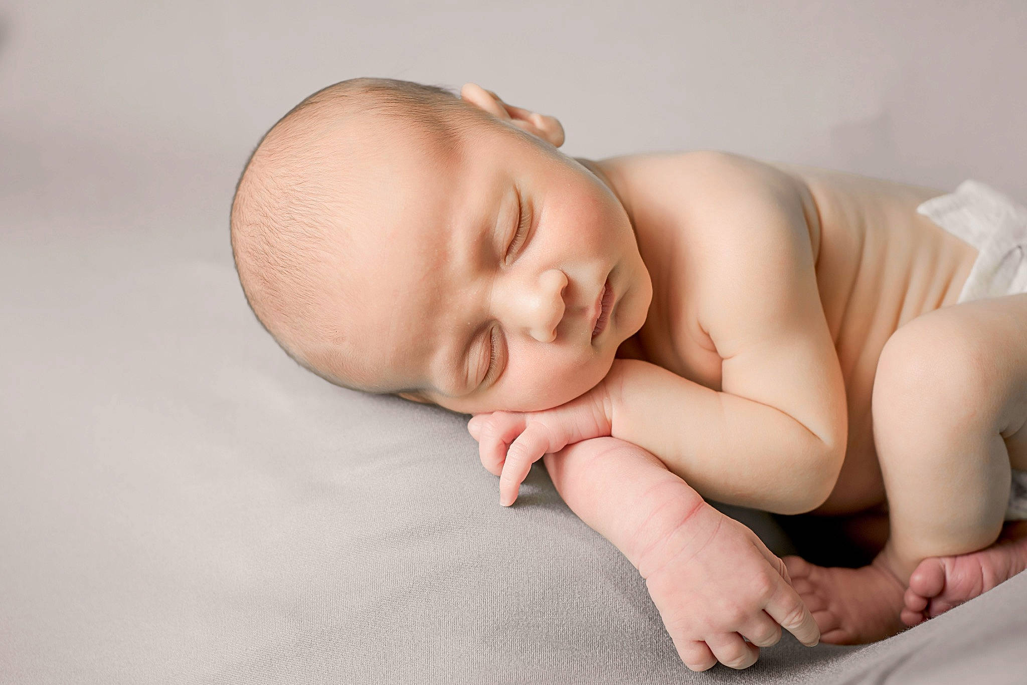 Raiden is registered to the contest to win money with this photo: arm, baby, baby_sleeping, baby_toddler_clothing, bedtime, cheek, child, comfort, eye, finger, flash_photography, flooring, hand, linens, mouth, nail, person, room, skin, toddler