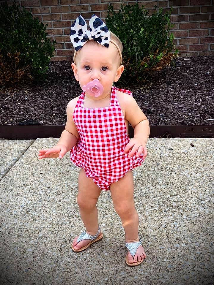 Delilah is registered to the contest to win money with this photo: baby, baby_toddler_clothing, child, cool, costume_hat, day_dress, fashion_accessory, fun, grass, happy, human_leg, magenta, pattern, people_in_nature, person, pink, plant, polka_dot, sleeve, smile