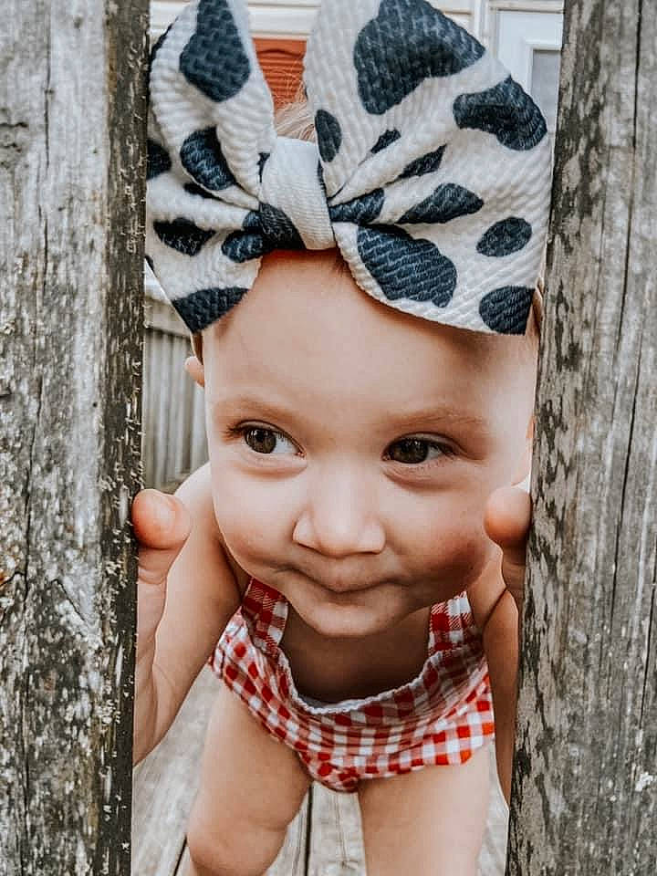 Delilah is registered to the contest to win money with this photo: baby, baby_toddler_clothing, cap, child, cool, costume_hat, face, flash_photography, happy, headgear, headpiece, headwear, leaf, lip, pattern, person, photograph, pink, plant, toddler