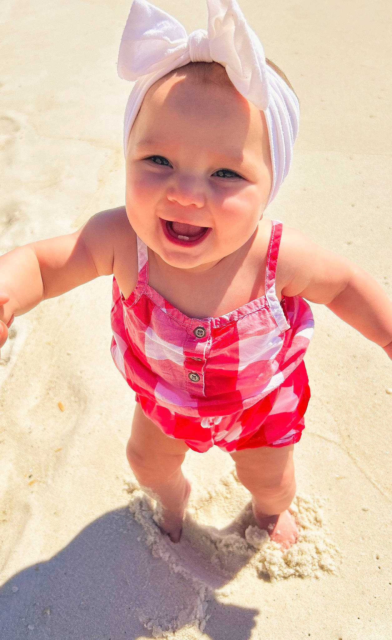 Gracelynn joined the competition — help win amazing prizes! baby, baby_toddler_clothing, beach, cap, child, face, finger, fun, gesture, happy, headgear, people_in_nature, people_on_beach, person, pink, recreation, skin, sleeve, smile, summer
