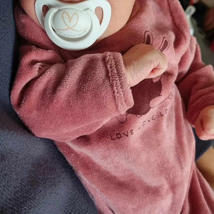 Talya participe au concours pour gagner de l'argent avec cette photo : baby, child, closeup, cozy, cuddly, cute, hand, indoor, infant, knit_hat, newborn, pacifier, person, pink_clothing, pink_hat, portrait, resting, soft_fabric, striped_sock, warm